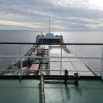 photo of cargo ship on body of water