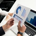 person holding white and blue box